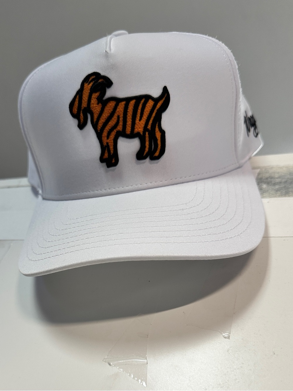 White Trucker Cap with Orange Goat Embroidered Patch by Waggle new